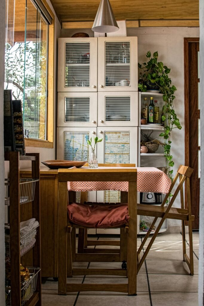 pexels-photo-259819-259819 Warm and cozy kitchen featuring wooden furniture and green plants.